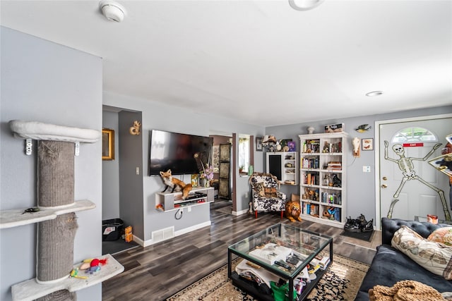 3935 8th St, Des Moines, IA 50313 - living area featuring wood finished floors and plenty of natural light