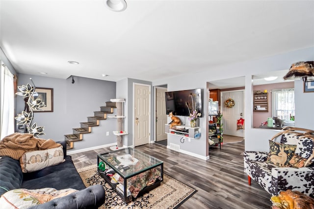 3935 8th St, Des Moines, IA 50313 - living room featuring stairs and wood finished floors