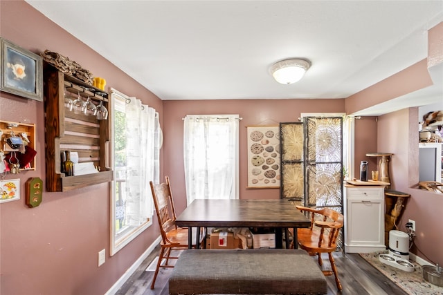 3935 8th St, Des Moines, IA 50313 - dining space featuring dark wood-style flooring and healthy amount of natural light