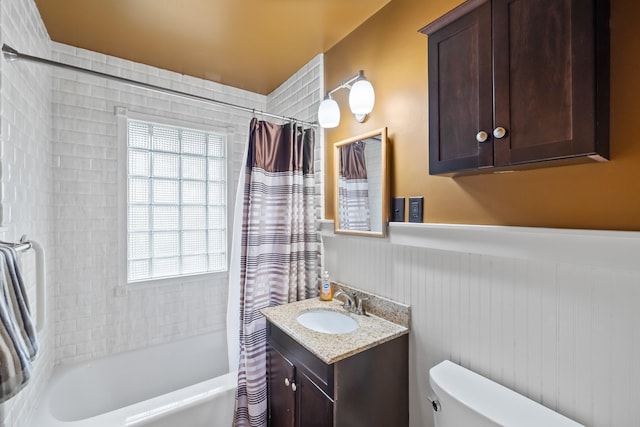 1232 Carrie Ave, Des Moines, IA 50315 - full bath featuring shower / tub combo with curtain, wainscoting, and vanity