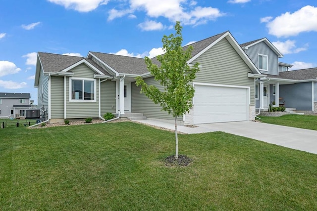 4412 NW 12th St, Ankeny, IA 50023 - ranch-style house with an attached garage, driveway, and a front yard
