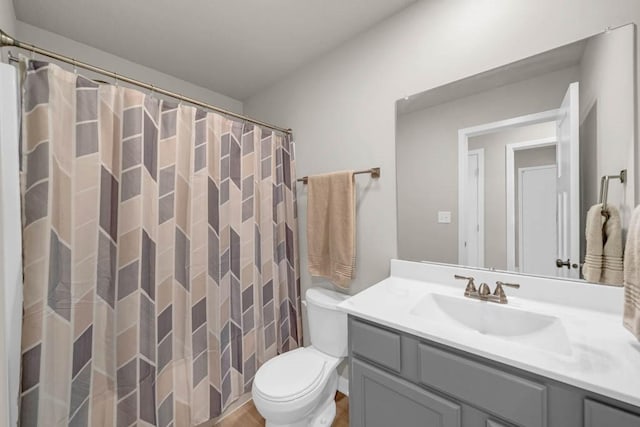 4412 NW 12th St, Ankeny, IA 50023 - full bathroom featuring vanity, wood finished floors, and a shower with shower curtain