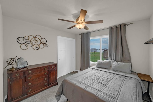 4412 NW 12th St, Ankeny, IA 50023 - bedroom with dark colored carpet, access to outside, and a ceiling fan