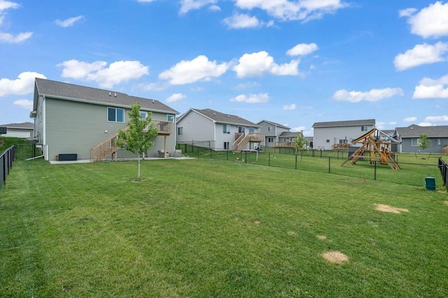 4412 NW 12th St, Ankeny, IA 50023 - fenced backyard with stairway, a residential view, and a playground