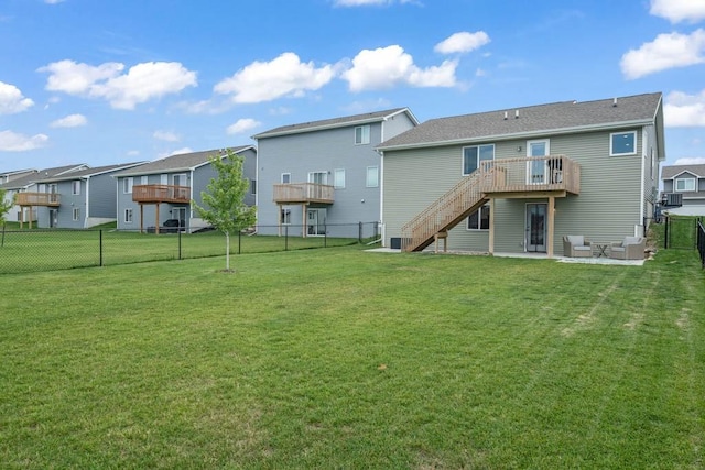 4412 NW 12th St, Ankeny, IA 50023 - rear view of property with a fenced backyard, stairs, a residential view, a wooden deck, and a patio area