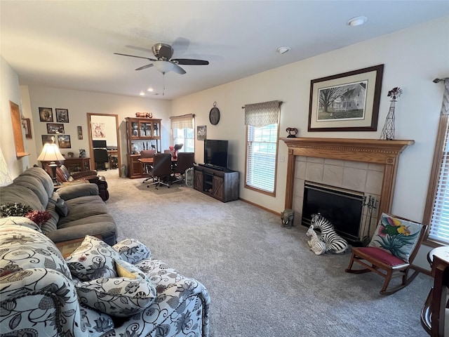 8 Chancery Ct, Newton, IA 50208 - carpeted living room with an office area, a ceiling fan, a tiled fireplace, and recessed lighting