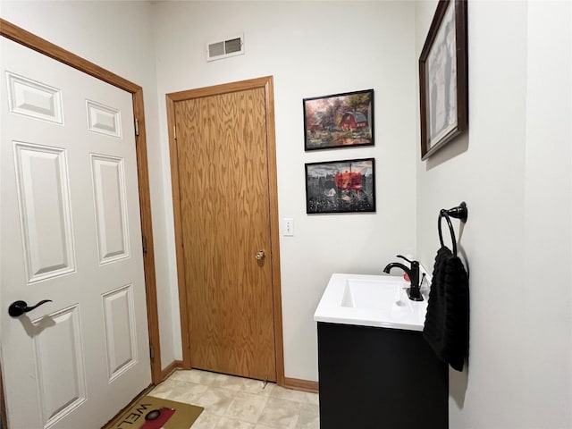 8 Chancery Ct, Newton, IA 50208 - bathroom featuring vanity and baseboards