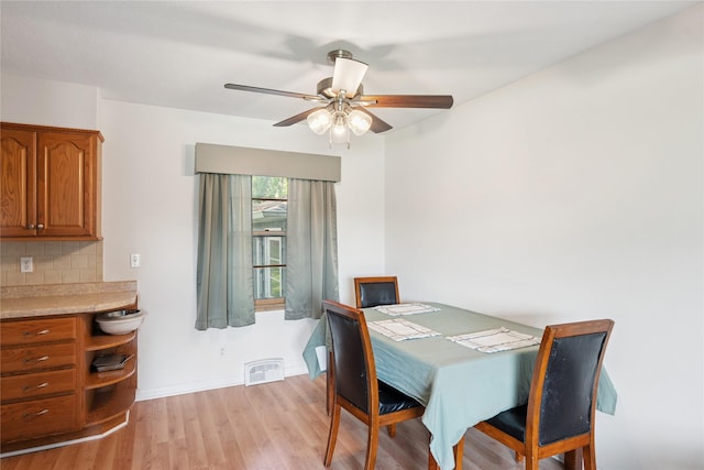 106 NW Scott St, Ankeny, IA 50023 - dining room with light wood-type flooring and ceiling fan