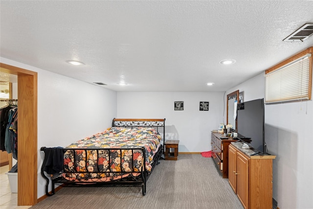106 NW Scott St, Ankeny, IA 50023 - bedroom featuring a textured ceiling, light colored carpet, and recessed lighting