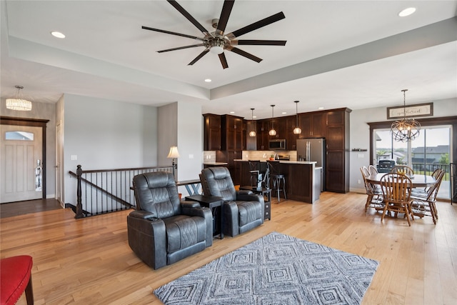 1609 NW Prairie Creek Dr, Grimes, IA 50111 - living area featuring a chandelier, light wood-type flooring, a ceiling fan, and recessed lighting
