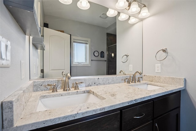 1609 NW Prairie Creek Dr, Grimes, IA 50111 - bathroom featuring double vanity and a shower with shower door