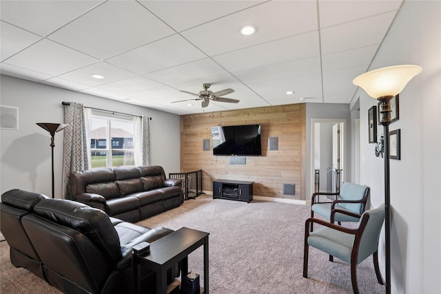 1609 NW Prairie Creek Dr, Grimes, IA 50111 - carpeted living area with wood walls, a ceiling fan, recessed lighting, and an accent wall