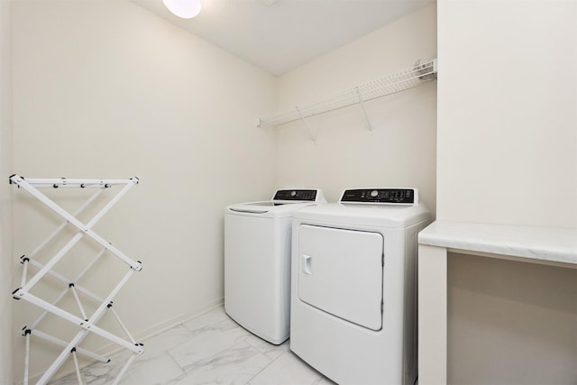 4774 172nd Way, Urbandale, IA 50323 - washroom with washer and clothes dryer and light marble finish flooring