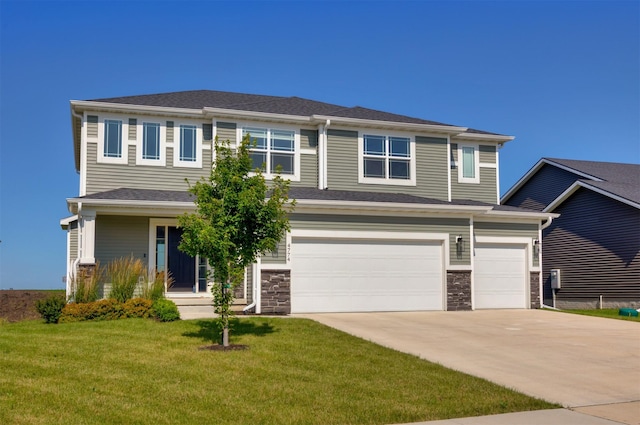 4774 172nd Way, Urbandale, IA 50323 - view of front of property with driveway, an attached garage, a front yard, and stone siding
