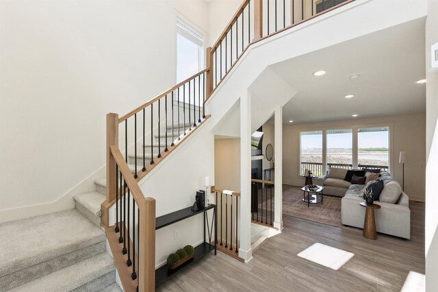 4774 172nd Way, Urbandale, IA 50323 - stairway with a water view, wood finished floors, and recessed lighting