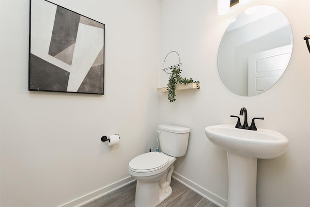 4774 172nd Way, Urbandale, IA 50323 - half bathroom featuring wood finished floors and baseboards