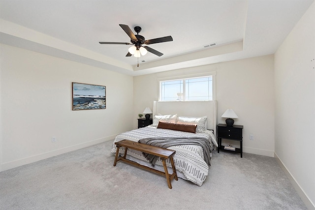 4774 172nd Way, Urbandale, IA 50323 - bedroom with a raised ceiling, light colored carpet, and ceiling fan