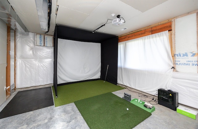 4774 172nd Way, Urbandale, IA 50323 - recreation room with golf simulator and concrete flooring