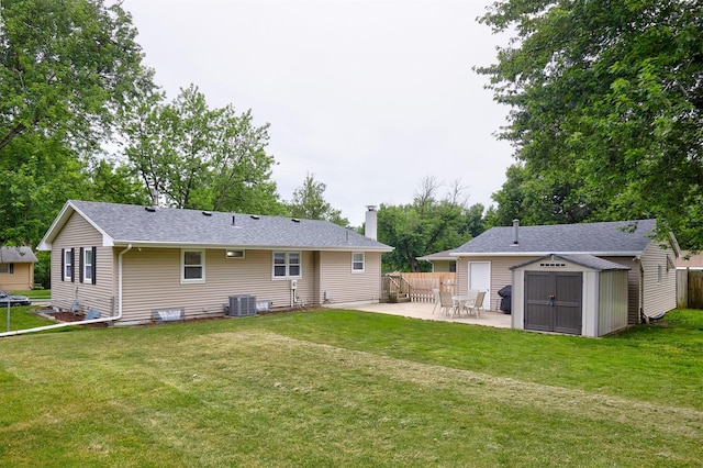 1802 W 5th Ave, Indianola, IA 50125 - rear view of house featuring a shed, a patio, and a chimney