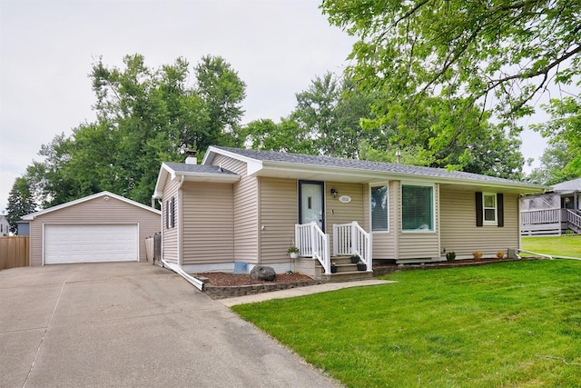 1802 W 5th Ave, Indianola, IA 50125 - single story home featuring an outbuilding, a detached garage, and a front lawn