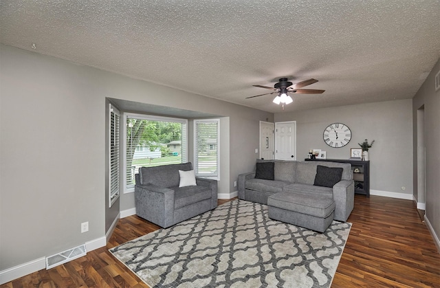 1802 W 5th Ave, Indianola, IA 50125 - living room with wood finished floors, a ceiling fan, and a textured ceiling