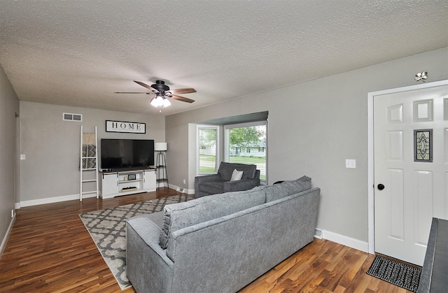 1802 W 5th Ave, Indianola, IA 50125 - living room featuring wood finished floors, a ceiling fan, and a textured ceiling