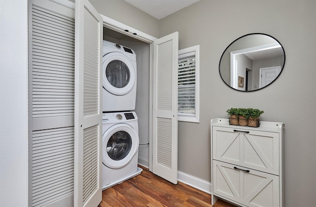 1802 W 5th Ave, Indianola, IA 50125 - laundry room featuring stacked washer / drying machine and wood finished floors