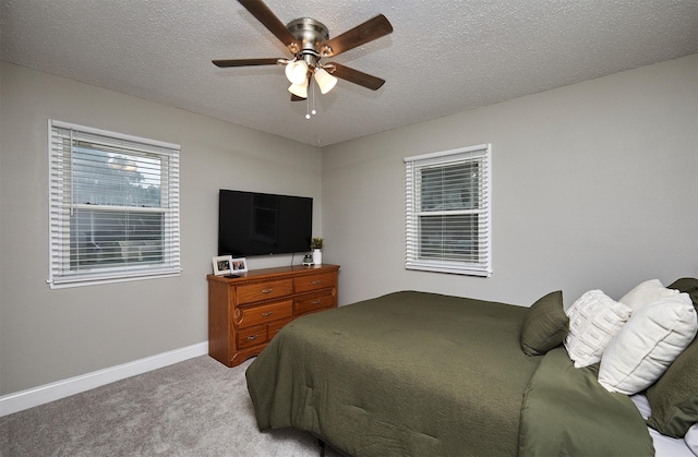 1802 W 5th Ave, Indianola, IA 50125 - carpeted bedroom with a ceiling fan and a textured ceiling