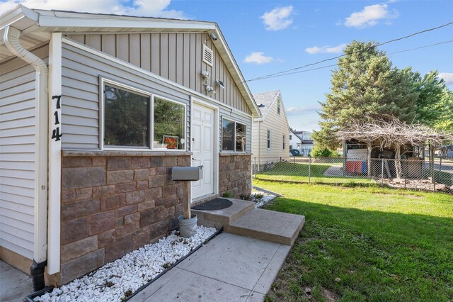 714 E 27th St, Des Moines, IA 50317 - view of property exterior featuring board and batten siding