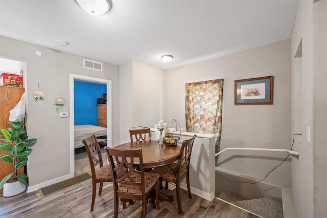 714 E 27th St, Des Moines, IA 50317 - dining room with wood finished floors and baseboards