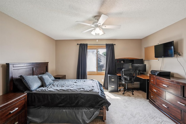 5428 NW 90th St, Johnston, IA 50131 - bedroom featuring light carpet, a desk, a textured ceiling, and ceiling fan