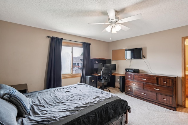 5428 NW 90th St, Johnston, IA 50131 - bedroom with light carpet, an office area, ceiling fan, and a textured ceiling