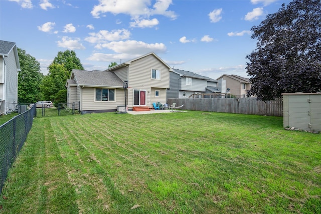 5428 NW 90th St, Johnston, IA 50131 - rear view of property with a fenced backyard, entry steps, a storage shed, and a patio area