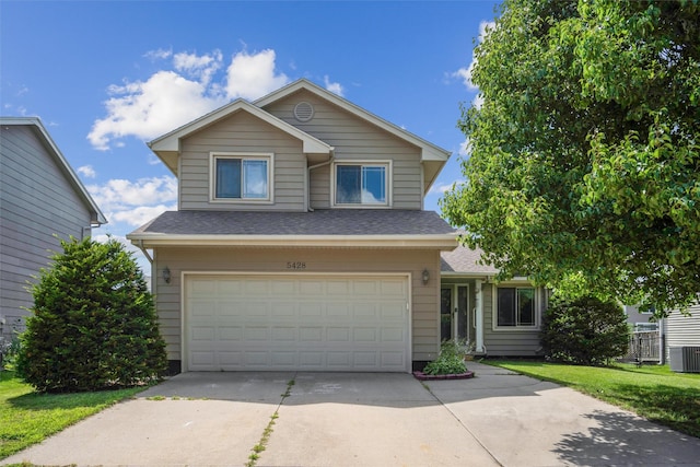 5428 NW 90th St, Johnston, IA 50131 - traditional home featuring a garage, driveway, roof with shingles, and a front lawn
