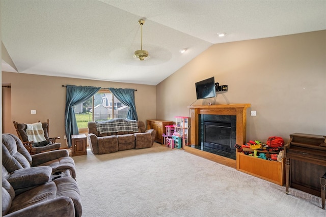 5428 NW 90th St, Johnston, IA 50131 - carpeted living room featuring vaulted ceiling, ceiling fan, and a fireplace with flush hearth
