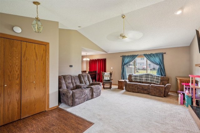 5428 NW 90th St, Johnston, IA 50131 - carpeted living area with lofted ceiling, a chandelier, and a ceiling fan