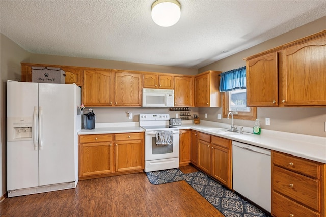 5428 NW 90th St, Johnston, IA 50131 - kitchen featuring white appliances, a textured ceiling, dark wood-style floors, light countertops, and brown cabinetry