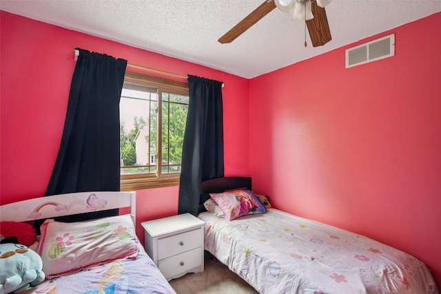 5428 NW 90th St, Johnston, IA 50131 - carpeted bedroom with a textured ceiling and ceiling fan