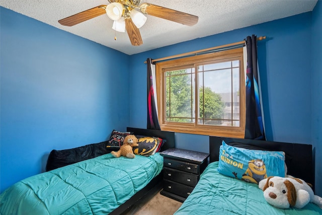 5428 NW 90th St, Johnston, IA 50131 - carpeted bedroom featuring a textured ceiling and ceiling fan