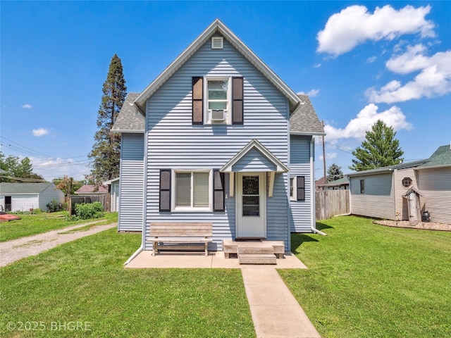 122 W Washington St, Colfax, IA 50054 - traditional-style home featuring a shingled roof and cooling unit