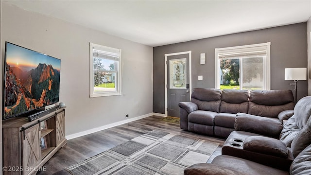 122 W Washington St, Colfax, IA 50054 - living area with wood finished floors and baseboards