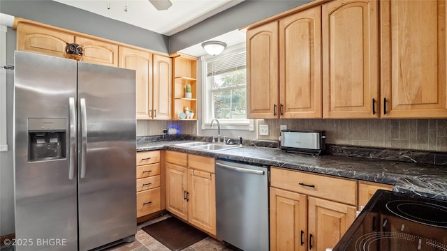 122 W Washington St, Colfax, IA 50054 - kitchen with stainless steel appliances, light brown cabinetry, dark countertops, and tasteful backsplash