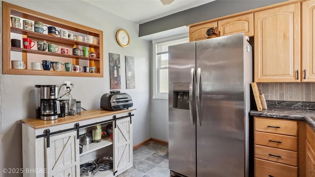 122 W Washington St, Colfax, IA 50054 - kitchen featuring stainless steel refrigerator with ice dispenser, light brown cabinetry, open shelves, and decorative backsplash