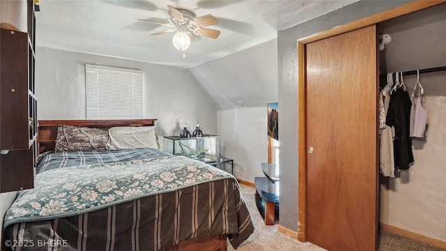 122 W Washington St, Colfax, IA 50054 - carpeted bedroom with vaulted ceiling, a closet, and ceiling fan