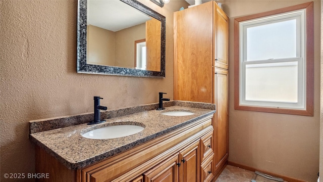 122 W Washington St, Colfax, IA 50054 - bathroom with double vanity and a textured wall