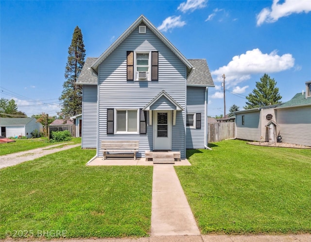 122 W Washington St, Colfax, IA 50054 - traditional home featuring a shingled roof and cooling unit