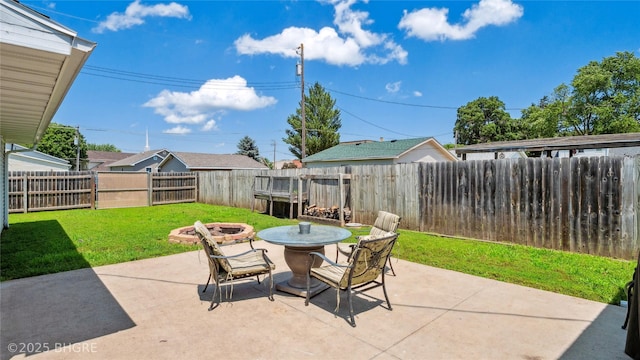 122 W Washington St, Colfax, IA 50054 - fenced backyard featuring an outdoor fire pit and a patio area