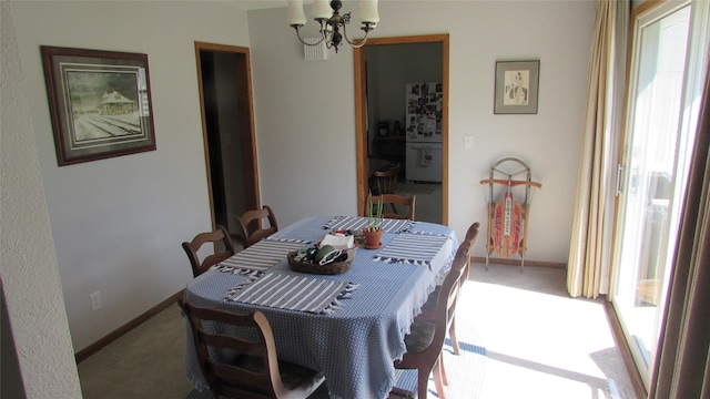 1401 N Grant St, Knoxville, IA 50138 - dining space with a chandelier and carpet floors