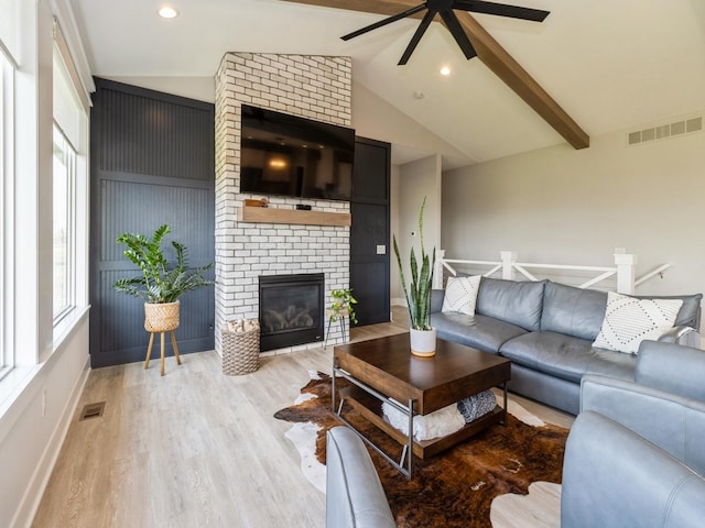 2013 Autumn Blaze Dr, Norwalk, IA 50211 - living room with a ceiling fan, wood finished floors, a brick fireplace, and recessed lighting