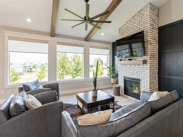2013 Autumn Blaze Dr, Norwalk, IA 50211 - living area featuring a ceiling fan, wood finished floors, and a fireplace